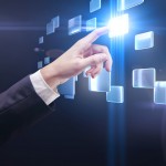 hand pushing a button on a touch screen interface