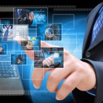 businessman hand pushing a button streaming images on a touch sc