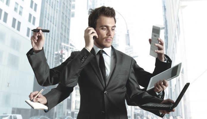 Businessman multitasking