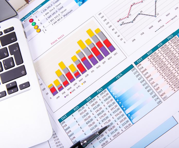 Graphs, charts, business table. The workplace of business people.