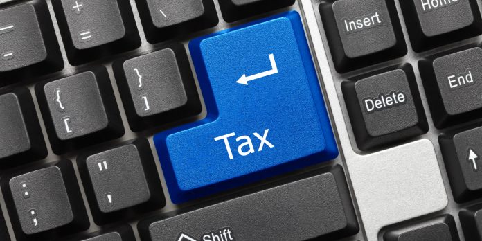 Conceptual keyboard - Tax (blue key) Digital tax: le sfide in ambito fiscale della digitalizzazione