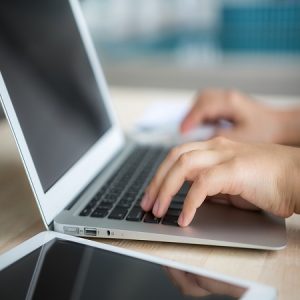 Closeup of business woman hand typing on laptop keyboard Closeup of business woman hand typing on laptop keyboard