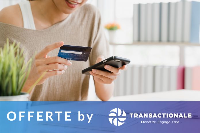 Beautiful Asian woman using smartphone buying online shopping by Offerte by Transactionale supporta gli eShop Italiani