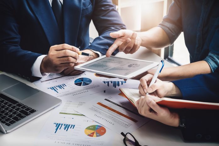 Business Finance, accounting, contract, advisor investment consulting marketing plan for the company with using tablet and computer technology in analysis. Digital consulting: gestire la trasformazione digitale