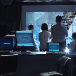 People working in mission control center