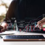Businessmen,Work,With,Stock,Market,Investments,Using,Tablets,To,Analyze