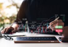 Businessmen,Work,With,Stock,Market,Investments,Using,Tablets,To,Analyze