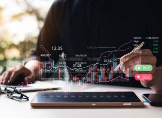 Businessmen,Work,With,Stock,Market,Investments,Using,Tablets,To,Analyze