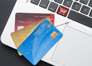 top-view-laptop-with-credit-card-phishing-hook - Device Code Phishing: