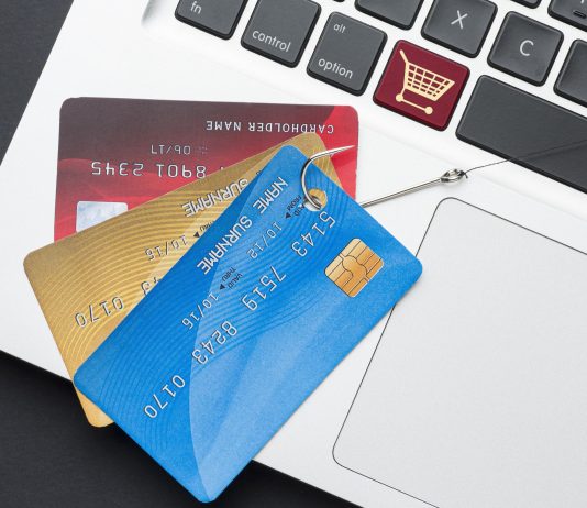 top-view-laptop-with-credit-card-phishing-hook - Device Code Phishing: