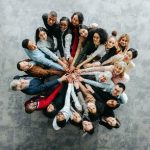 Top,View,Of,A,Diverse,Team,Of,People,Joining,Hands