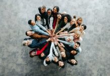 Top,View,Of,A,Diverse,Team,Of,People,Joining,Hands