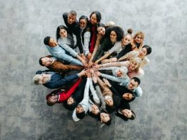 Top,View,Of,A,Diverse,Team,Of,People,Joining,Hands